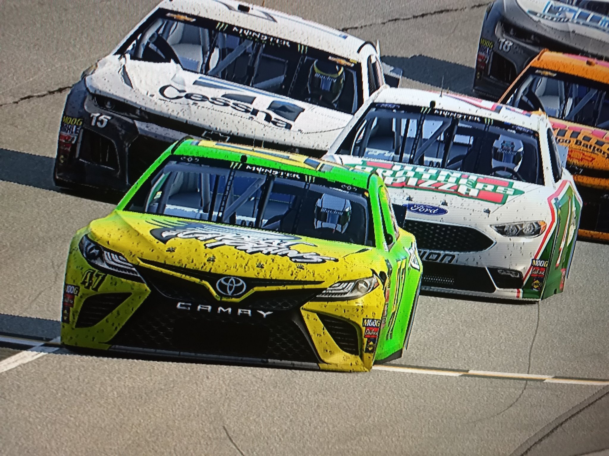 Yellow #47 Toyota Camry leading pack at Las Vegas