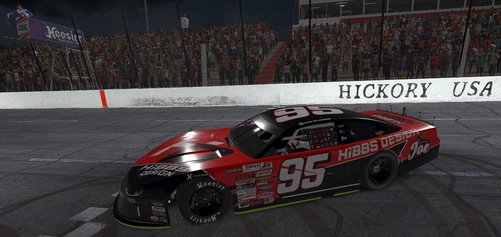 Red #95 stock car at stadium